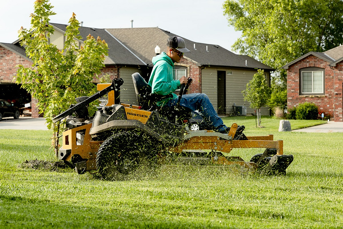 Man Mowing Lawn In Wichita Ks