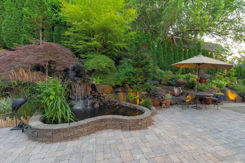 Brick Patio With Pond And Water Feature